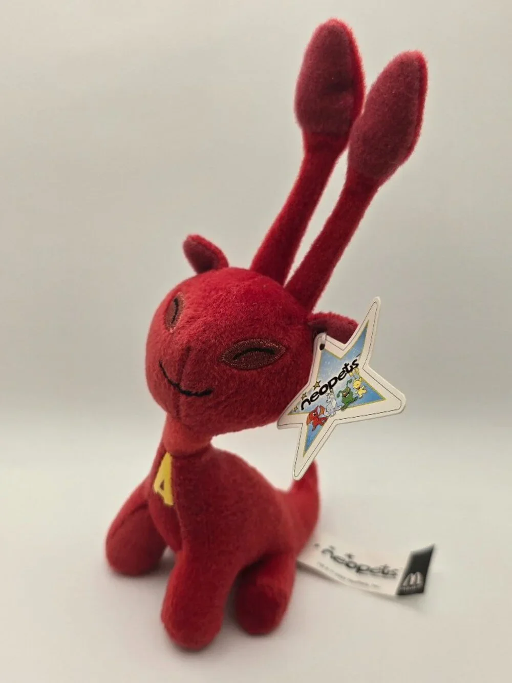 McDonald's Neopets Red Aisha Plushie 2004 Excellent condition with tags.